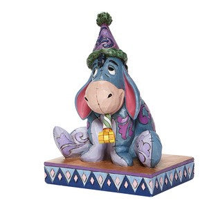 DISNEY TRADITIONS BY JIM SHORE EEYORE WITH BIRTHDAY HAT 15CM