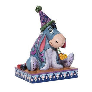 DISNEY TRADITIONS BY JIM SHORE EEYORE WITH BIRTHDAY HAT